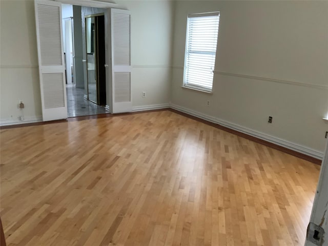 unfurnished room featuring light hardwood / wood-style flooring