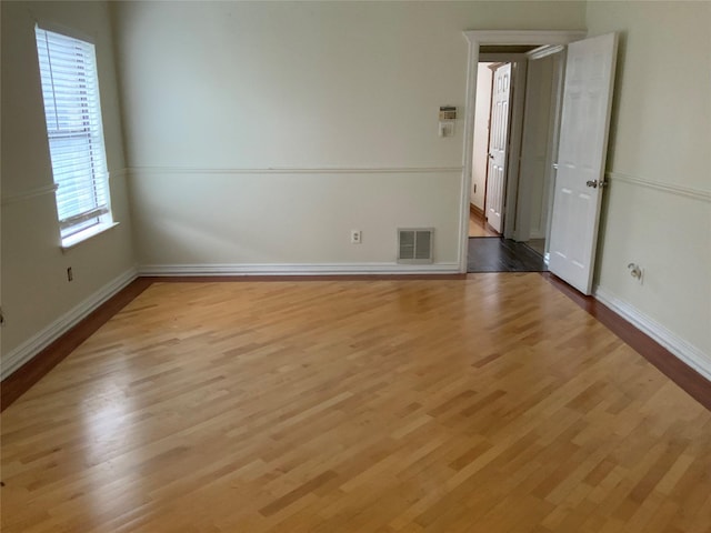 unfurnished room featuring light wood-type flooring