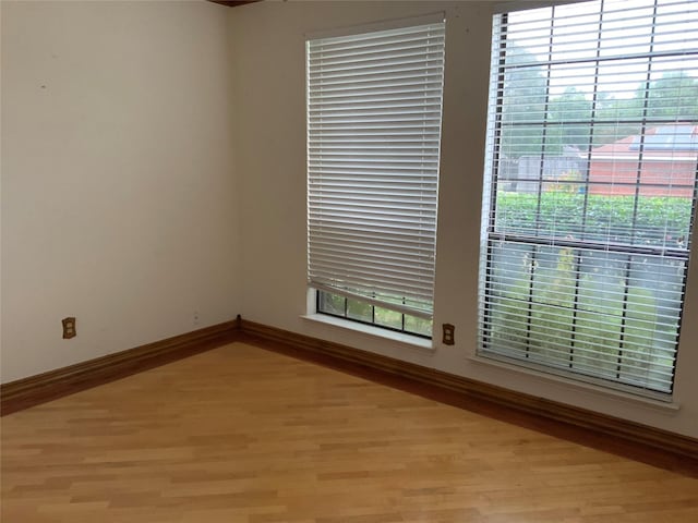 empty room with light hardwood / wood-style floors