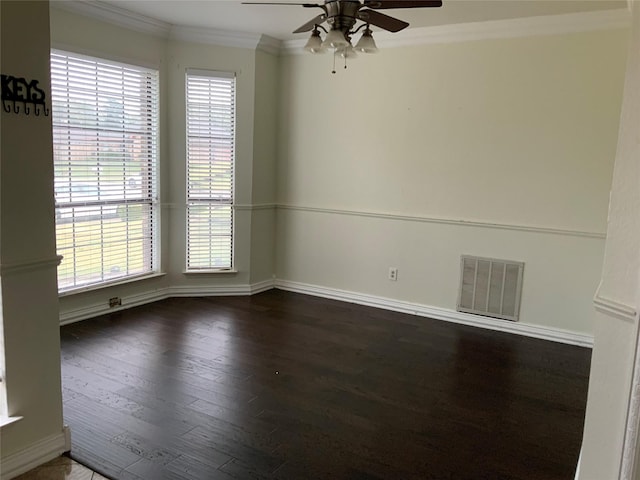 unfurnished room featuring dark hardwood / wood-style floors, ceiling fan, ornamental molding, and a wealth of natural light