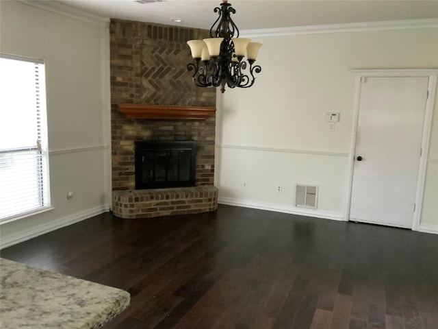 unfurnished living room featuring dark hardwood / wood-style flooring and ornamental molding