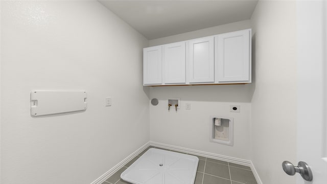 laundry area with electric dryer hookup, washer hookup, tile patterned floors, cabinets, and hookup for a gas dryer