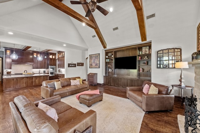 living room featuring built in shelves, ceiling fan, beam ceiling, high vaulted ceiling, and dark hardwood / wood-style floors