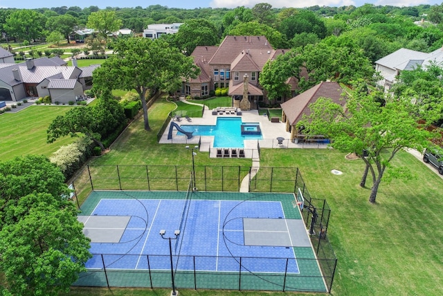 view of sport court with a lawn and tennis court