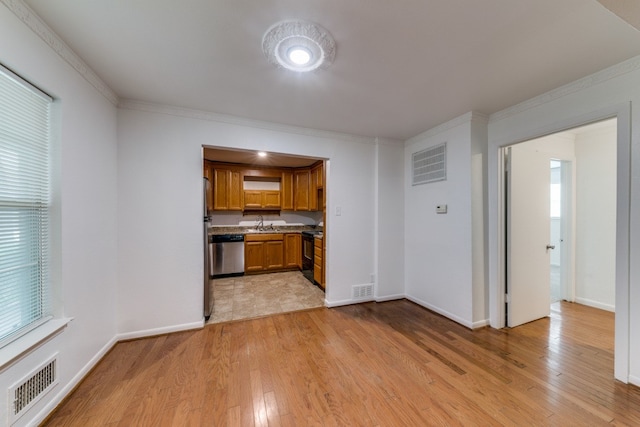 kitchen with dishwasher, black / electric stove, light tile patterned floors, and a healthy amount of sunlight