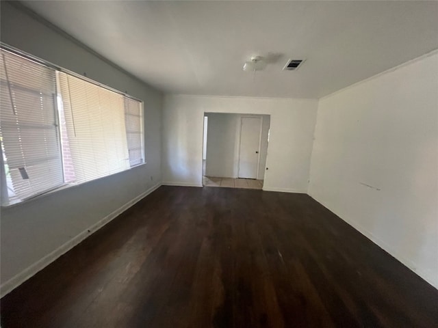 empty room with hardwood / wood-style floors