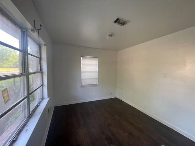 spare room with wood-type flooring