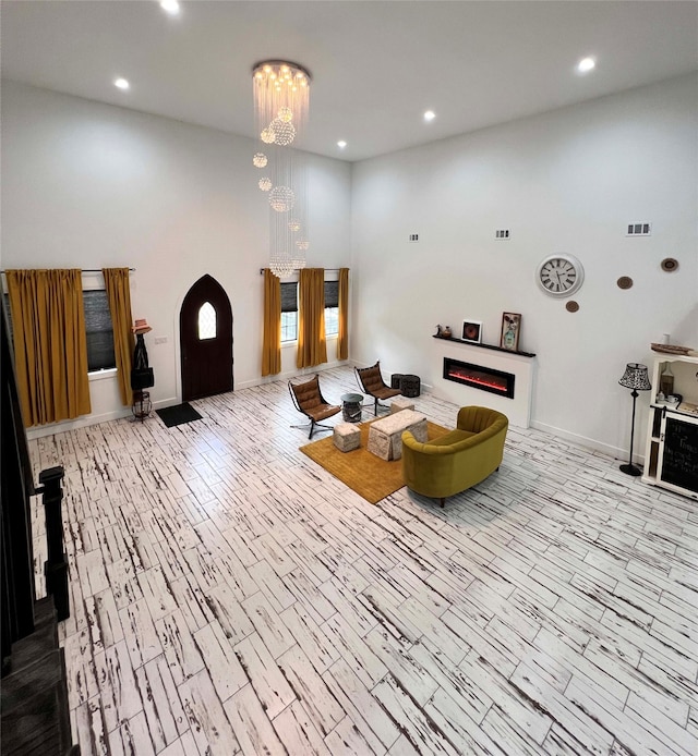 interior space featuring a notable chandelier and light hardwood / wood-style floors