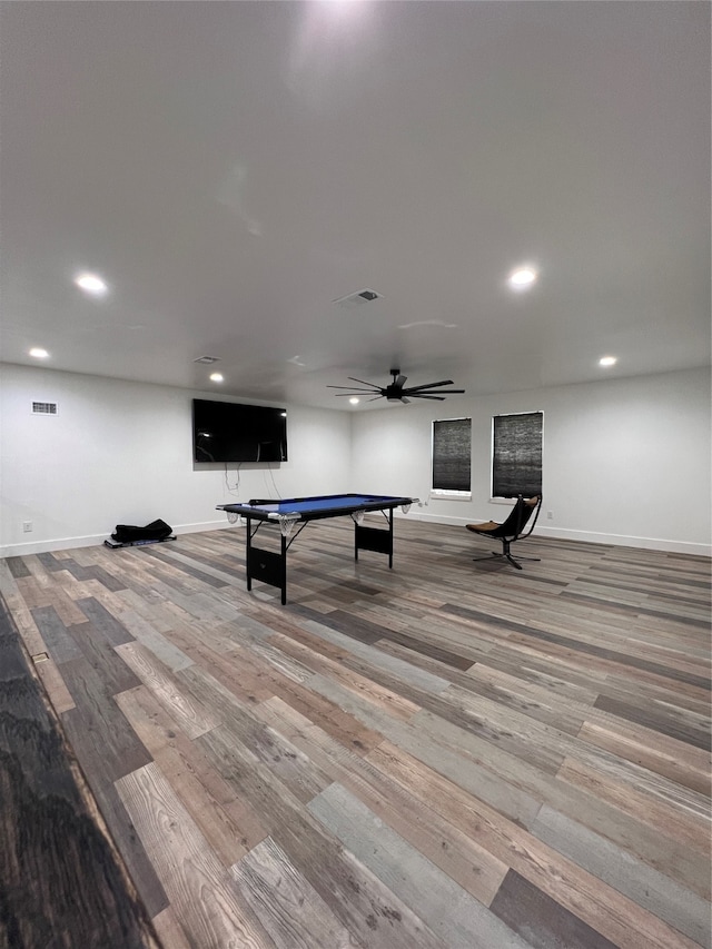 rec room featuring ceiling fan and hardwood / wood-style flooring