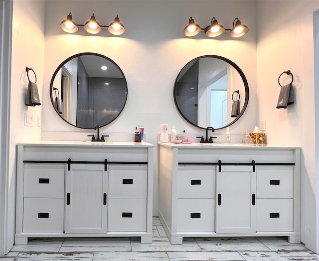 bathroom with tile patterned flooring and vanity