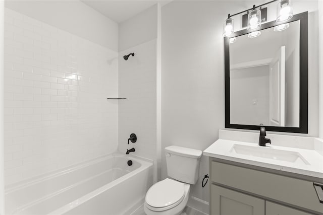 full bathroom featuring vanity, tiled shower / bath combo, and toilet