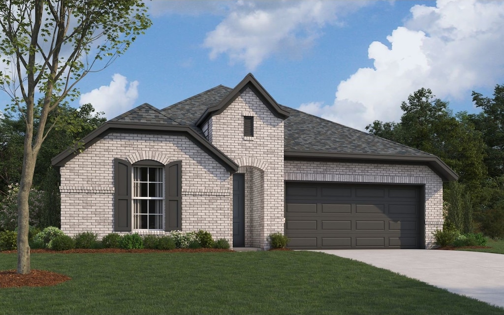 view of front of home with a front lawn and a garage