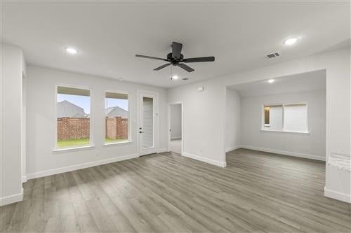 unfurnished room featuring wood-type flooring and ceiling fan