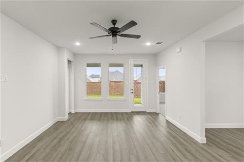 unfurnished room featuring ceiling fan and wood-type flooring