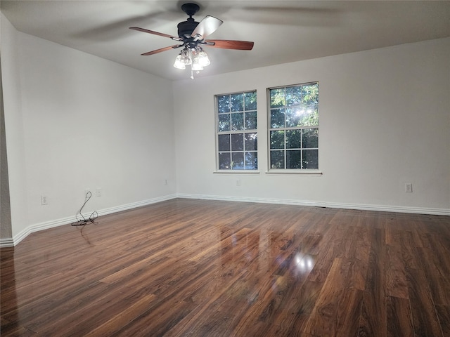 empty room featuring dark hardwood / wood-style floors and ceiling fan