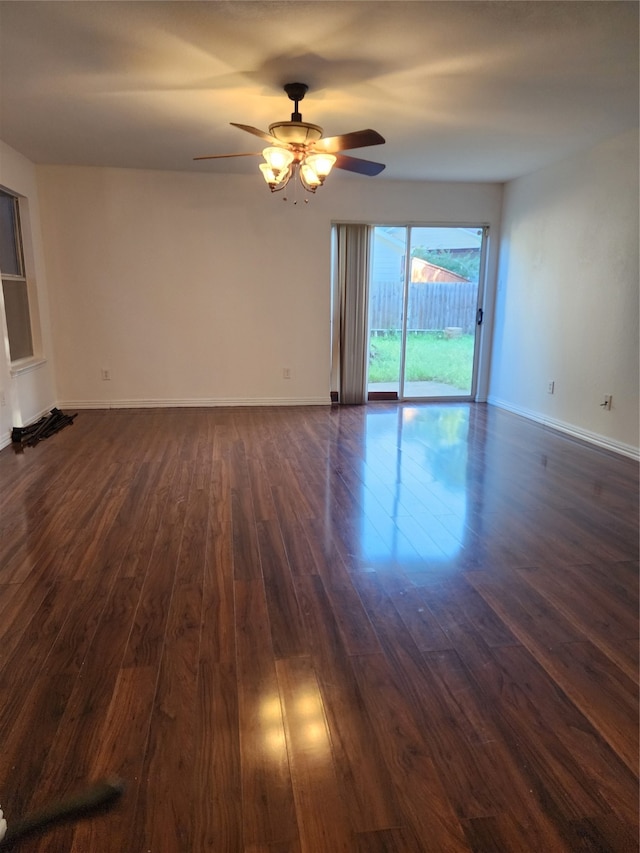 unfurnished room featuring dark hardwood / wood-style floors and ceiling fan