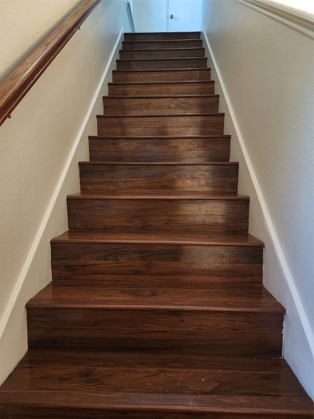 stairway featuring hardwood / wood-style flooring