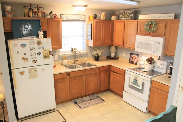 kitchen with sink and white appliances