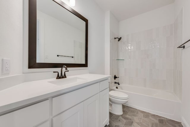 full bathroom featuring vanity, tiled shower / bath combo, and toilet