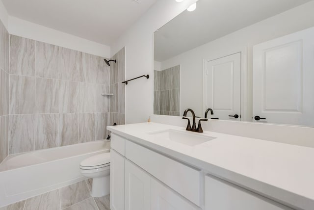 full bathroom with vanity, toilet, and tiled shower / bath