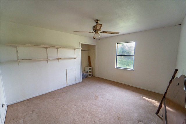 unfurnished bedroom featuring carpet and ceiling fan