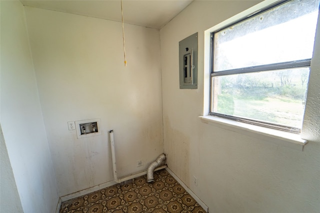 clothes washing area featuring washer hookup and dark tile flooring