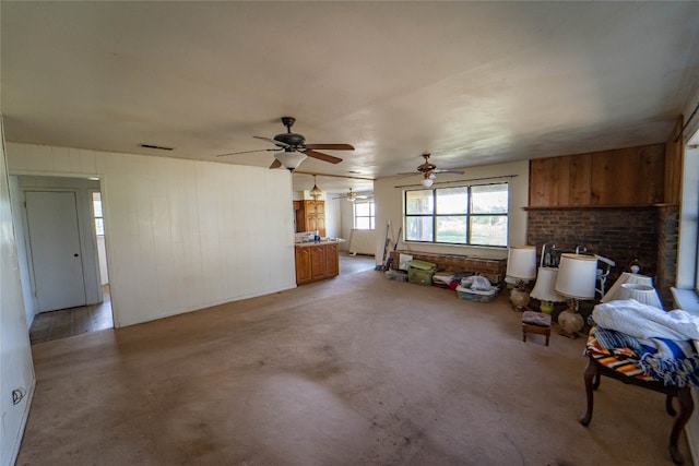 interior space featuring a fireplace and ceiling fan