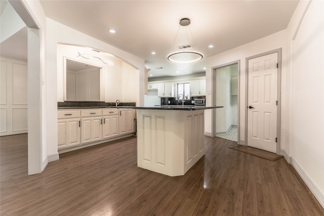 unfurnished living room featuring french doors, dark tile floors, ceiling fan, and a fireplace