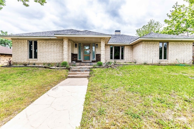 prairie-style house with a front yard