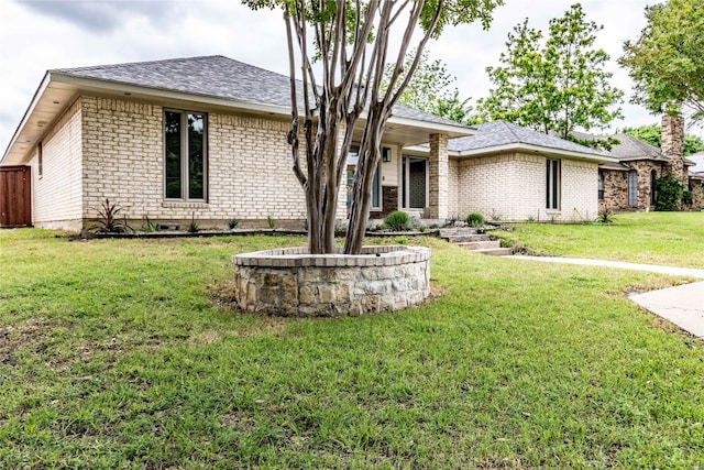 ranch-style home with a front lawn