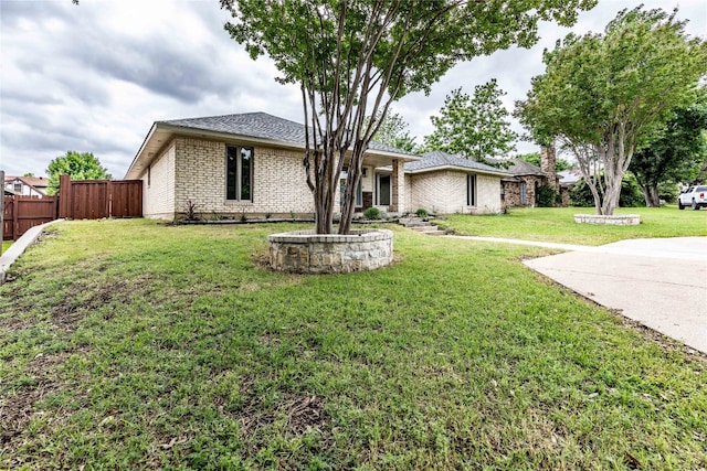 ranch-style home featuring a front yard