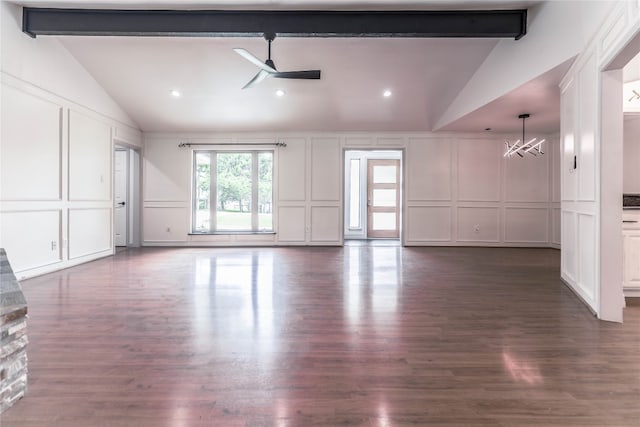 interior space with beamed ceiling, ceiling fan with notable chandelier, and dark hardwood / wood-style floors