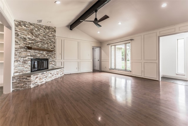 unfurnished living room featuring lofted ceiling with beams, ceiling fan, dark hardwood / wood-style floors, and a fireplace