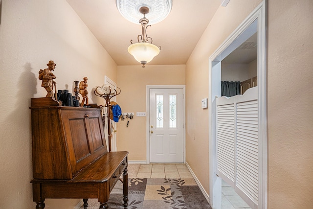 doorway with light tile floors