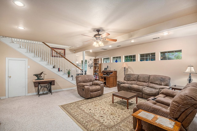 living room featuring carpet flooring and ceiling fan