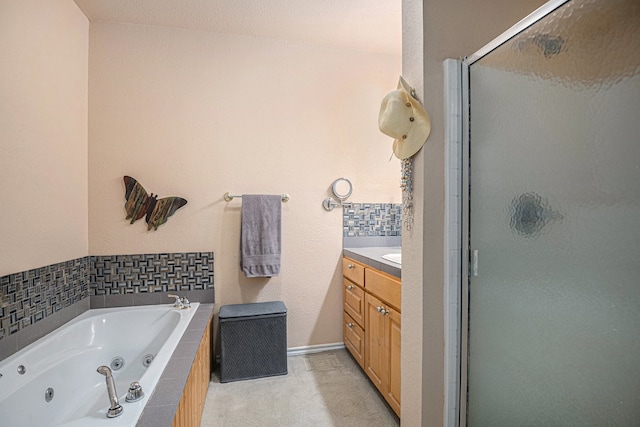 bathroom with shower with separate bathtub and vanity