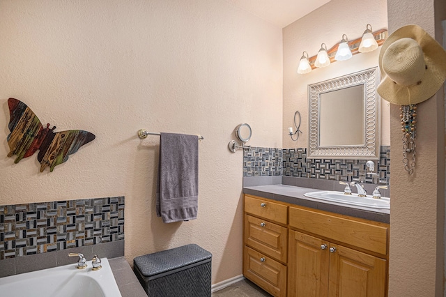 bathroom featuring backsplash, a bath to relax in, and large vanity