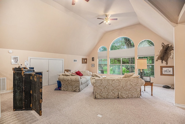 carpeted living room featuring vaulted ceiling and ceiling fan