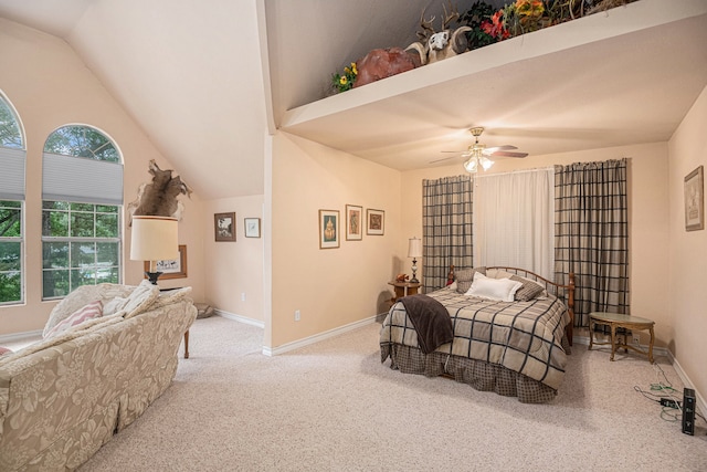 carpeted bedroom featuring ceiling fan and vaulted ceiling