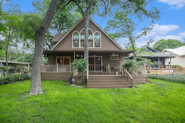 rear view of property with a porch and a yard