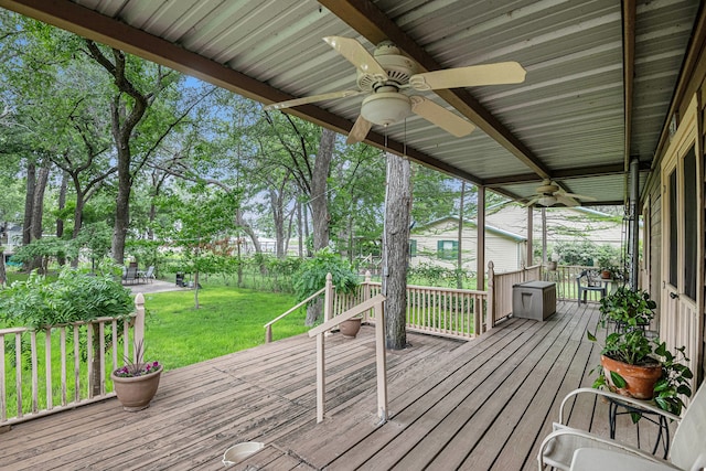 deck featuring a yard and ceiling fan