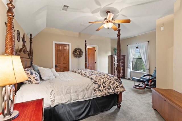 bedroom featuring lofted ceiling, ceiling fan, and light colored carpet