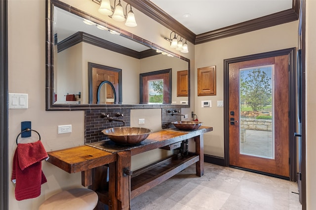 dining area featuring crown molding and sink