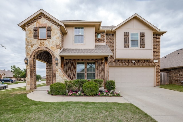 view of front of house featuring a garage and a front yard