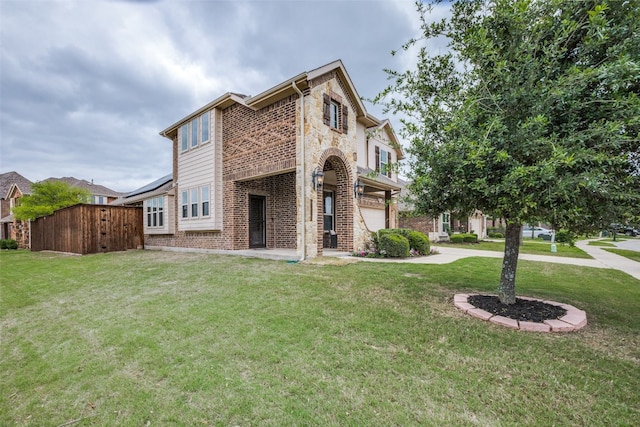 view of front of house with a garage and a front yard