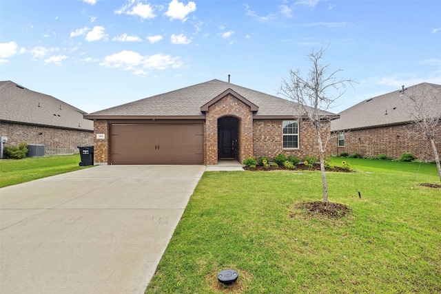 single story home featuring a garage, a front lawn, and central AC unit