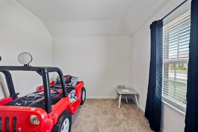 carpeted bedroom featuring lofted ceiling