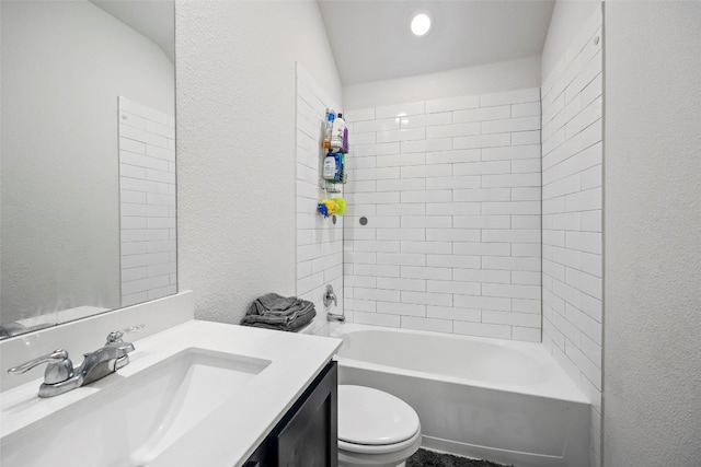 full bathroom featuring vanity, toilet, and tiled shower / bath