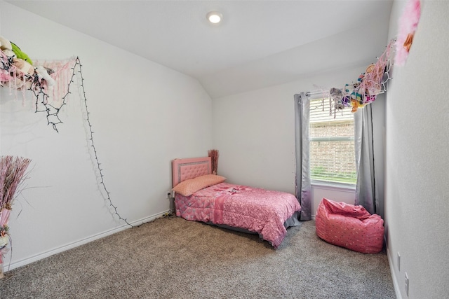 bedroom featuring carpet flooring and vaulted ceiling