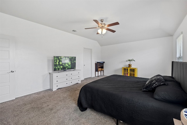 bedroom featuring lofted ceiling, ceiling fan, and carpet